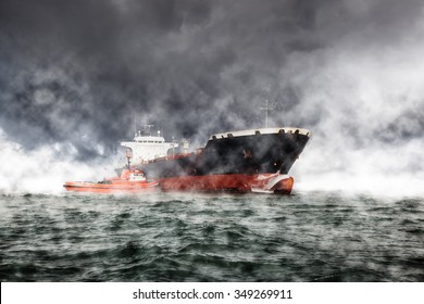 Cargo Ship At Sea During A Storm.