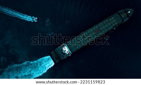 cargo ship test engine system after being repaired in dark sea, photograph over process art style, aerial top view from drone