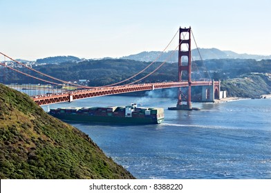 Cargo Ship Under The Golden Gate Bridge.