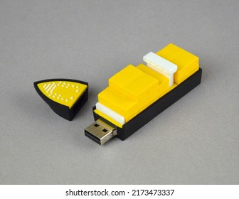 Cargo Ship USB Memory Flash Drive Stick For Logistics Sector. Promotional Items For Forwarders Transporters Carriers. Yellow Black Cargo Ship 3D Model Isolated Close Up Photo With Containers.