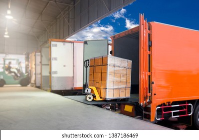 Cargo shipment loading for truck. Distribution warehousing and Logistics. Industry transport by freight truck. Forklift loading cargo into a truck. trucks docking at the warehouse.