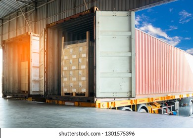 Cargo shipment loading for truck. Road freight truck transportation. Interior of warehouse dock load shipment into container truck. Business shipping logistics. 