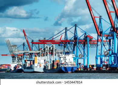 Cargo ships at the terminal in Hamburg, Germany - Shutterstock ID 1453447814