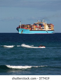 Cargo Sip With Jetski Rider In Front