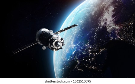 Cargo spaceship on orbit of the Earth planet. Cities lights and space on background. Elements onf this image furnished by NASA. - Powered by Shutterstock