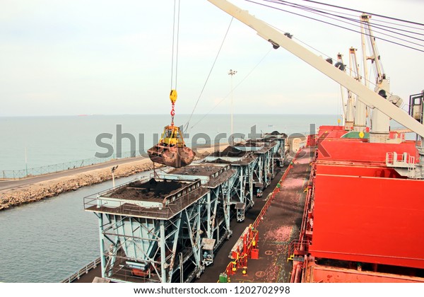 Cargo terminal for discharging coal by ships\
cranes. Type of berths with cargo ships and the water area of ​​the\
port of Tuticorin, India.