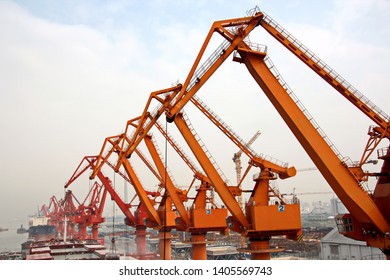 Cargo terminal for unloading grain cargo and containers by shore cranes. Port Guangzhou, China. February, 2019.