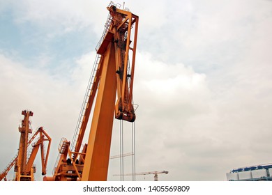 Cargo terminal for unloading grain cargo and containers by shore cranes. Port Guangzhou, China. February, 2019.