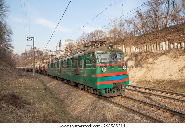 Cargo\
train with oil tanker cars on the railway\
track
