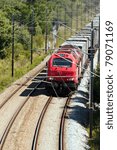 Cargo Train passing with some  freight wagons, in Portugal