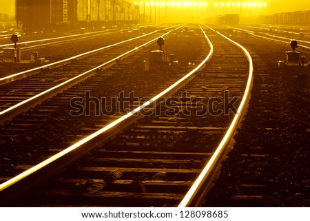 Cargo train platform at sunset with container