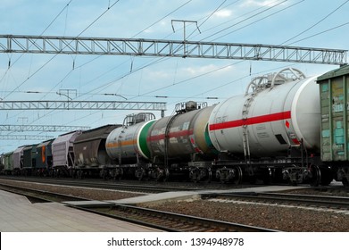 Cargo Train In Sorting Freight Railway Station, Intermodal Rail Freight Transportation. Tank Car LNG By Rail, Natural Gas  