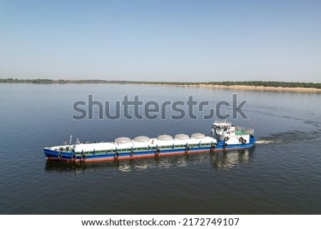 Cargo transportation of oil products. An old cargo ship on the Volga River transports oil to the port of Volgograd. Russia