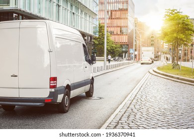 Cargo van parked on a street in a city