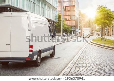 Cargo van parked on a street in a city