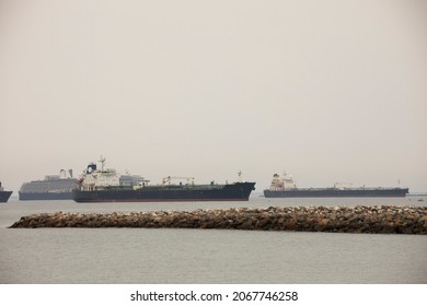 Cargo vessels dock off the California coast. - Shutterstock ID 2067746258