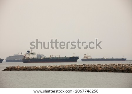 Cargo vessels dock off the California coast.