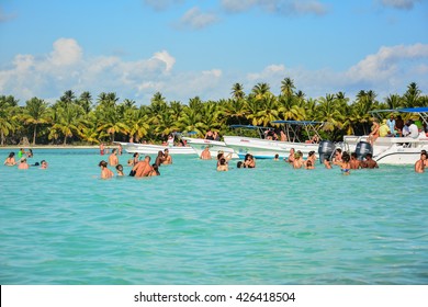 CARIBBEAN, DOMINICAN REPUBLIC - JANUARY 13, 2016 -  Landscape Punta Cana Tropical Island With Coconut Palms And White Beaches Of The Dominican Republic With People In The Turquoise Waters