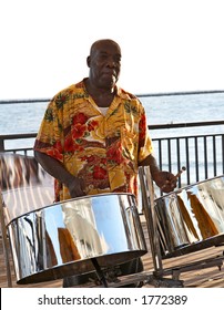 A Caribbean Musician Playing Steel Drums.