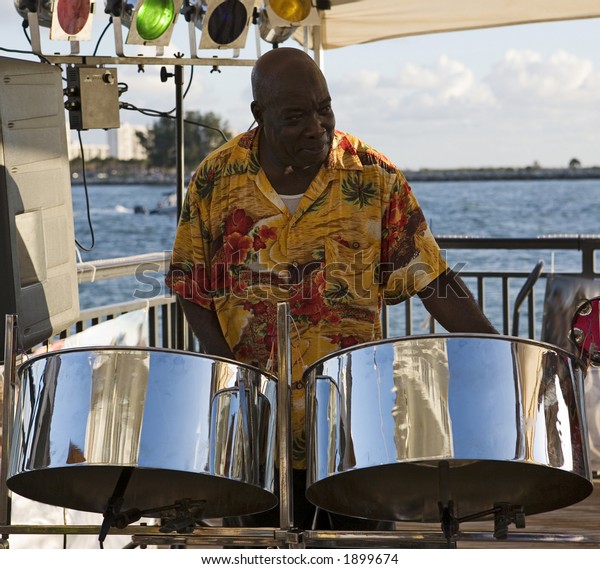Caribbean Musician Playing Steel Drums Ocean Stock Photo Edit Now 1899674 caribbean-musician-playing-steel-drums-ocean-stock-photo-edit-now-1899674