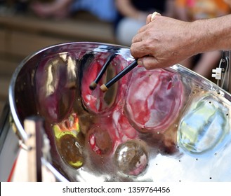 Caribbean Steel Pan Drum Player With Sticks