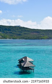 Caribbean Stilt House In The Blue Sea