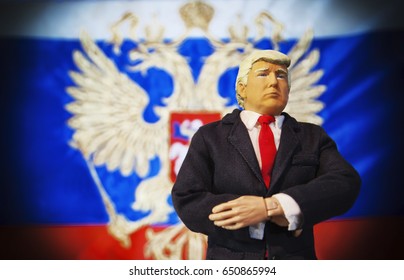 Caricature Of United States President Donald Trump Standing In Front Of A Russian Flag - Russian Interference Concept - Conspiracy And Controversy