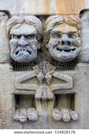 Caricature Wall Sculpture Depicting Two Faces With Different Expressions