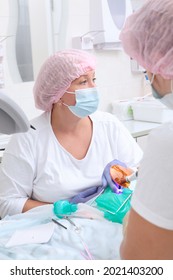 Caries Treatment Of Primary Teeth Under General Anesthesia. Child Is Under Anesthesia. Vertical Photo. Breathing Tube During Surgery.