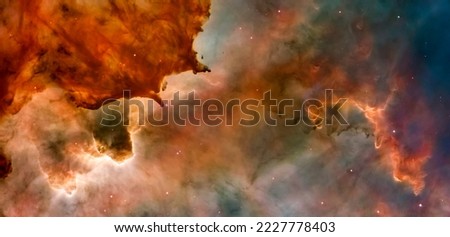 Carina Nebula Clouds by James Webb Space Telescope in panorama. Elements of this image are furnished by NASA.
