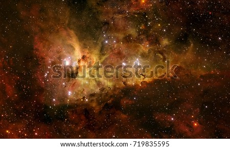 The Carina Nebula is a large bright nebula that surrounds several clusters of stars. Also known as the Eta Carinae Nebula, Grand Nebula. Retouched image. Elements of this image furnished by NASA.