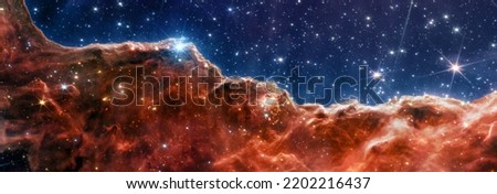 Carina Nebula. Star-forming region in the deep space. Gas accumulations in outer space. James webb telescope research of galaxies. Space landscape. JWST. Elements of this image furnished by NASA.