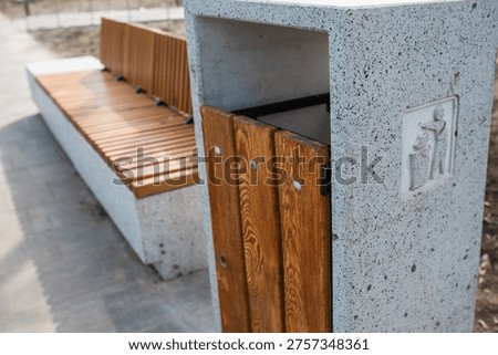 Caring about an enviroment, separating garbage into different continers. Garbage bins for separate waste sorting in park. Separate garbage collection containers on a park. Collection of plastic, paper, glass and mixed wasted for further processing
