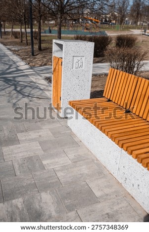 Caring about an enviroment, separating garbage into different continers. Garbage bins for separate waste sorting in park. Separate garbage collection containers on a park. Collection of plastic, paper, glass and mixed wasted for further processing