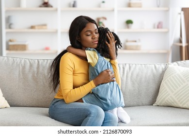 Caring African American Mom Comforting Upset Little Daughter At Home, Worry Mom Soothing Crying Kid, Sad Black Female Child Embracing Mother, Feeling Parent Support And Protection, Copy Space