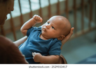 A caring bond between a caregiver and a baby is beautifully captured in this moment - Powered by Shutterstock