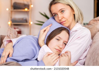Caring Caucasian mother talk comfort unhappy sad teenage daughter suffering from school bullying or psychological problems, loving mom support make peace with depressed introvert teen girl child