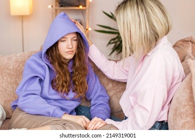 Caring Caucasian mother talk comfort unhappy sad teenage daughter suffering from school bullying or psychological problems, loving mom support make peace with depressed introvert teen girl child