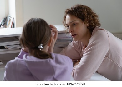 Caring Caucasian Mother Talk Support Unhappy Upset Teen Daughter Suffering From School Bullying Or Discrimination Problems. Loving Mom Comfort Cheer Sad Teenage Girl Child, Make Peace After Fight.