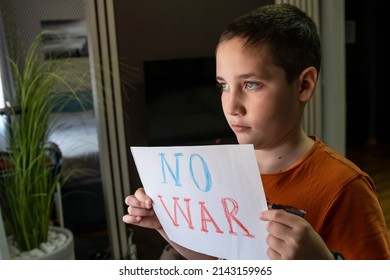 Caring For Each Other. Military Protest. Child With Message Stop War. Child Raises A Banner With The Inscription No War. Kids Is Protesting. Activism Concept. Request For Help To World Community.