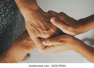 Caring elderly grandma wife holding hand supporting senior grandpa husband give empathy care love, old married grandparents couple together two man and woman hope understanding concept, close up view - Shutterstock ID 2253179543