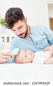 Caring Father Removes Cradle Cap From His Baby's Scalp