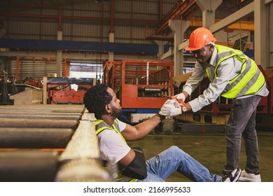 Caring Friendship And Sympathy For Workers Who Are Injured During Work Concept : Male African American Worker Injured In Arm Wearing Cast Sits In Pain Gets Sympathy For Help To Take Sick Leave To Heal