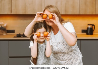 Caring grandmother and little granddaughter are having fun baking cookies together in the home kitchen. A loving elderly grandmother and granddaughter prepare a delicious sweet cake. - Shutterstock ID 2279199623