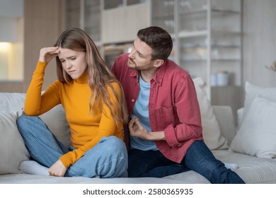 Caring guy trying to explain justify to emotional girl. Offended wife ignoring husband making excuses. Spouses squabbling, arguing, fighting. Quarrel over distrust, jealousy, insecurity of woman.
