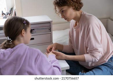 Caring Mother Comforting Upset Teenage Daughter, Holding Hands, Sitting At Desk, Loving Mum Supporting Sad Teen Girl, Discussing Problems, Sharing Secrets, Trusted Family Relationship Concept