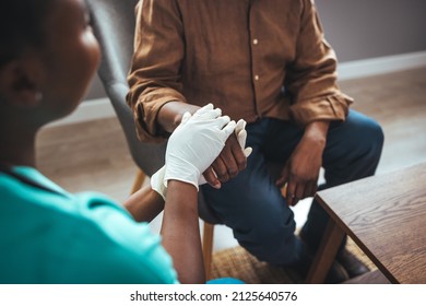 Caring Nurse In White Coat Holding Hands Of Old Man Patient Express Compassion Provide Physical Or Psychological Help, Arms Close Up. Concept Of Relief Loneliness, Incurable Disease, Nursing, Empathy