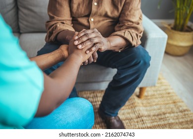 Caring Nurse In White Coat Holding Hands Of Old Man Patient Express Compassion Provide Physical Or Psychological Help, Arms Close Up. Concept Of Relief Loneliness, Incurable Disease, Nursing, Empathy