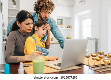 Caring parents communicating about daughter's medical condition with a doctor via video call during corona virus pandemic. - Powered by Shutterstock