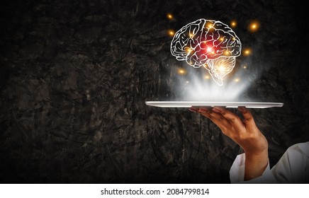 Caring For Patients With Brain Disease Concept : Female Doctor Holding Tablet And Showing Human Brain Icon For Neuropathy And Brain Disease Treatment.